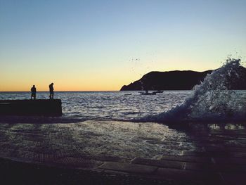 Scenic view of sea at sunset