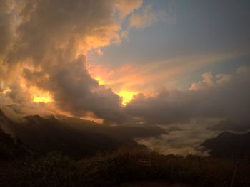 Low angle view of dramatic sky during sunset