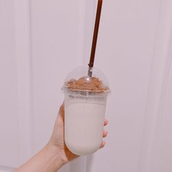 Close-up of hand holding drink