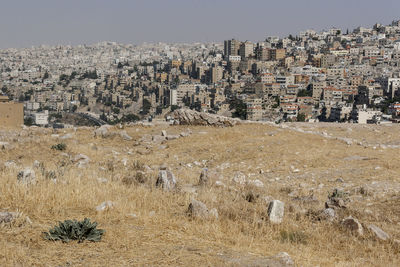 Buildings in city against clear sky