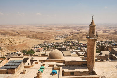 Panoramic view of mardin sanitary historical emir hamam baths, city roofs and mesopotamian plain