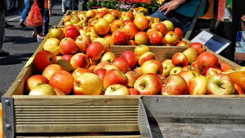 Fresh apples in crates for sale at street market