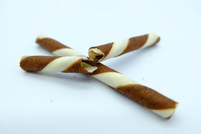 High angle view of bread on white background