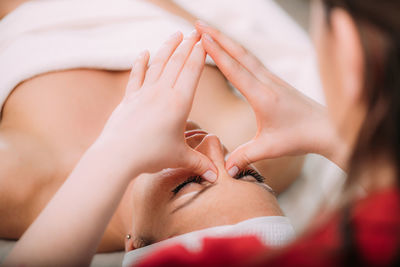 Face lifting massage, beautiful woman getting face lifting massage in a beauty salon.