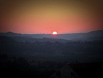 Scenic view of landscape against sky during sunset