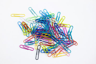 Close-up of multi colored pencils over white background