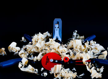 High angle view of toys on table against black background