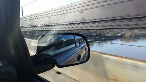 Close-up of side-view mirror of car