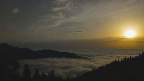 Scenic view of silhouette mountains against sky during sunset