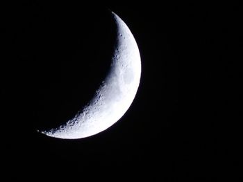 Low angle view of moon against sky at night