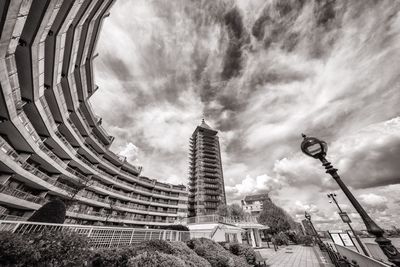 Low angle view of building against cloudy sky