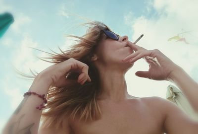 Low angle view of young woman