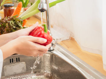 Midsection of man preparing food at home