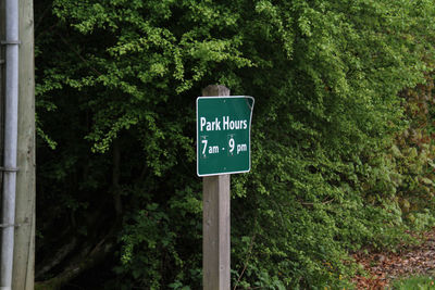 Information sign against trees