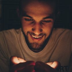 Close-up of man holding light