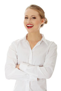 Portrait of a smiling young woman over white background