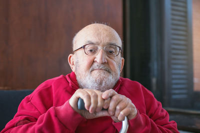 Portrait of senior man smoking cigarette