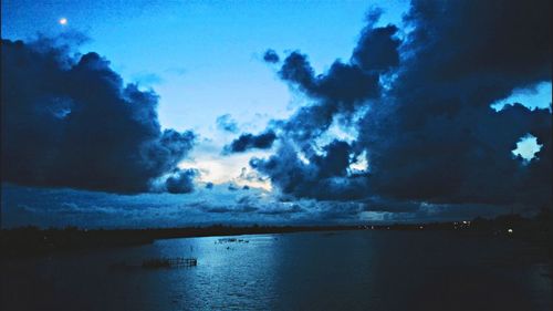 Scenic view of sea against cloudy sky