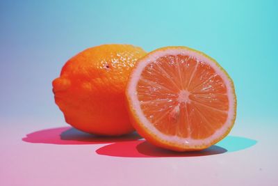 Close-up of lemons on blue background