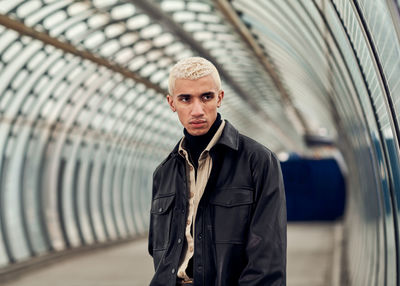 Portrait of young man standing outdoors