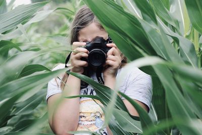Portrait of woman photographing