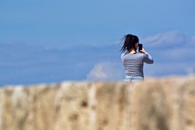 Rear view of woman on beach