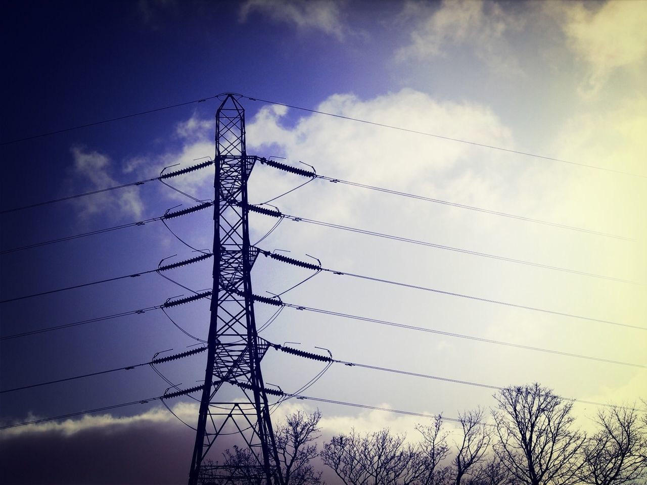 power line, electricity pylon, low angle view, power supply, electricity, sky, connection, cable, silhouette, fuel and power generation, cloud - sky, technology, power cable, cloudy, cloud, tree, sunset, bare tree, dusk, nature