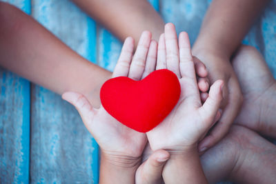 Cropped image of person holding gift box