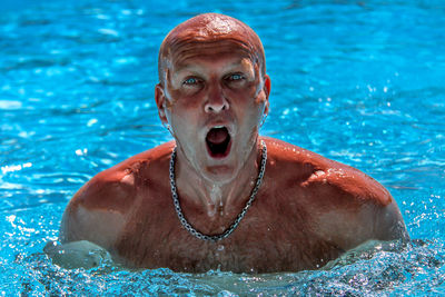 Portrait of man swimming