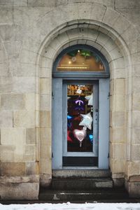 Balloons on door of building