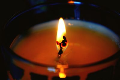 Close-up of illuminated tea light candle