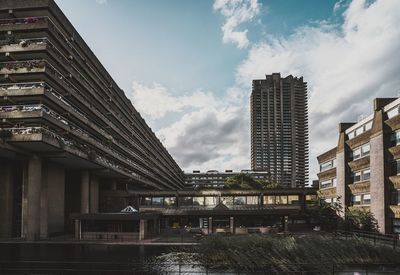 Modern brutalist buildings against sky in city