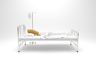 Empty chairs and table against white background