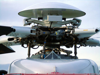Close-up of helicopter propeller against sky