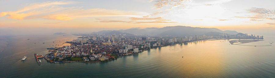 High angle view of sea against sky at sunset