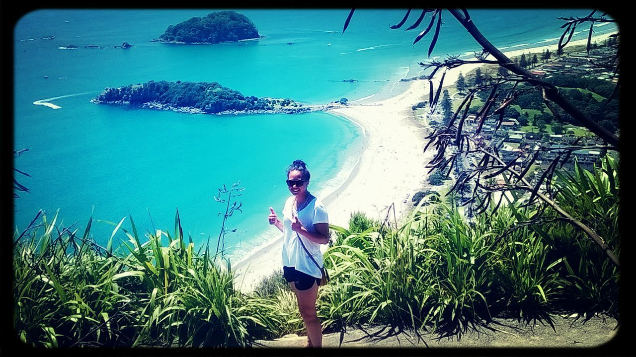 transfer print, leisure activity, lifestyles, auto post production filter, blue, sea, water, full length, rear view, casual clothing, standing, horizon over water, men, vacations, nature, plant, person, tranquility