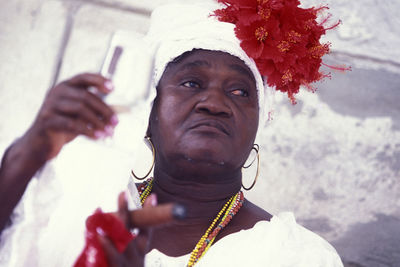 Portrait of woman holding flowers