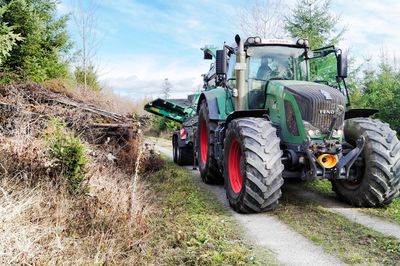 Tractor on farm against sky