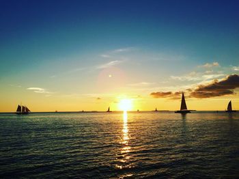 View of sailboat in sea at sunset