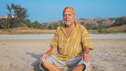 Portrait of a man sitting on beach