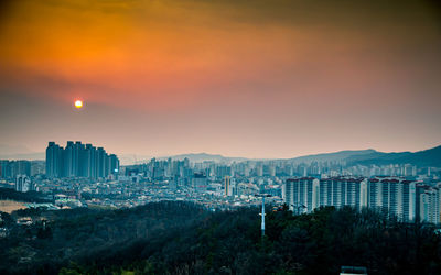 High angle view of buildings against sky during sunset