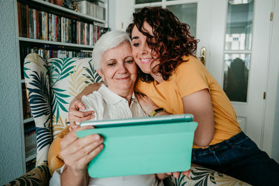 Senior woman and daughter at home