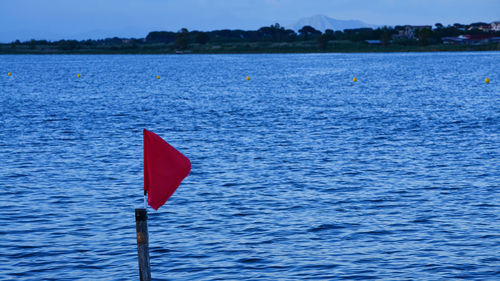 Red flag against river