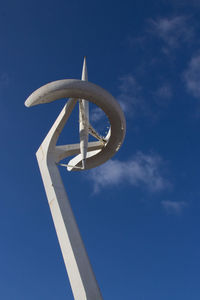 Low angle view of communication pole against sky