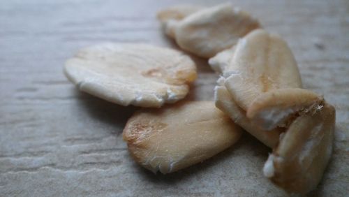 Close-up of pat flakes on table