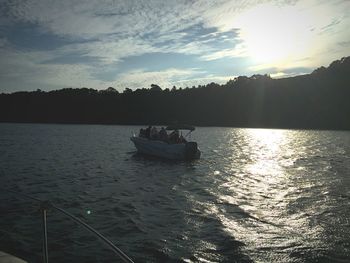 Scenic view of river against sky at sunset