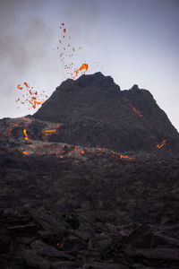 Scenic view of volcanic mountain against sky