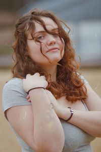Portrait of young woman looking down