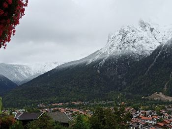Aerial view of townscape against mountain range