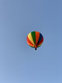 Low angle view of hot air balloon against clear sky